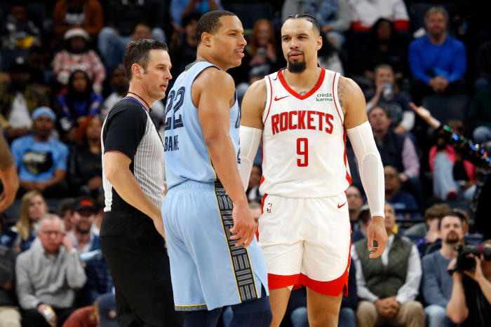 Grizzlies guard Desmond Bane (22) and Houston Rockets forward Dillon Brooks (9) are separated by a referee during the second half at FedExForum.
